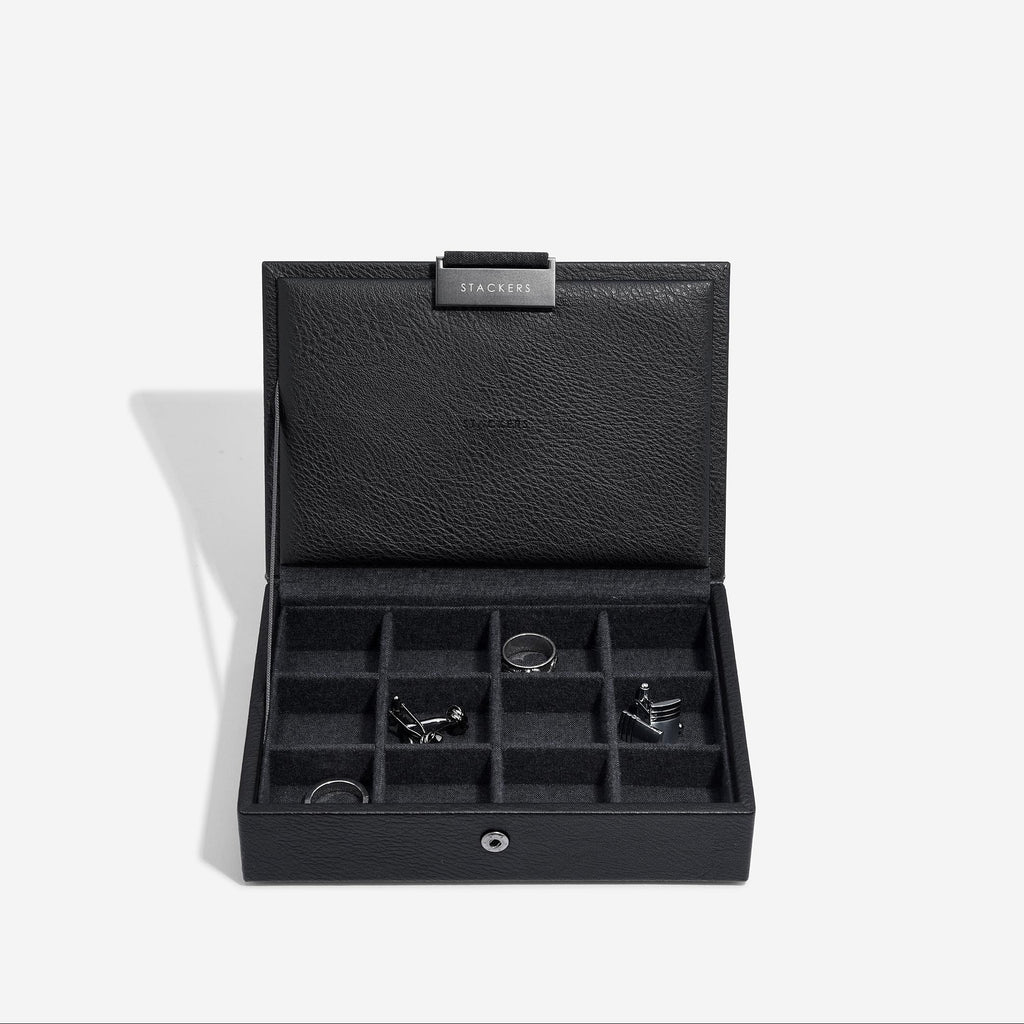 Black jewelry box with compartments on a white background