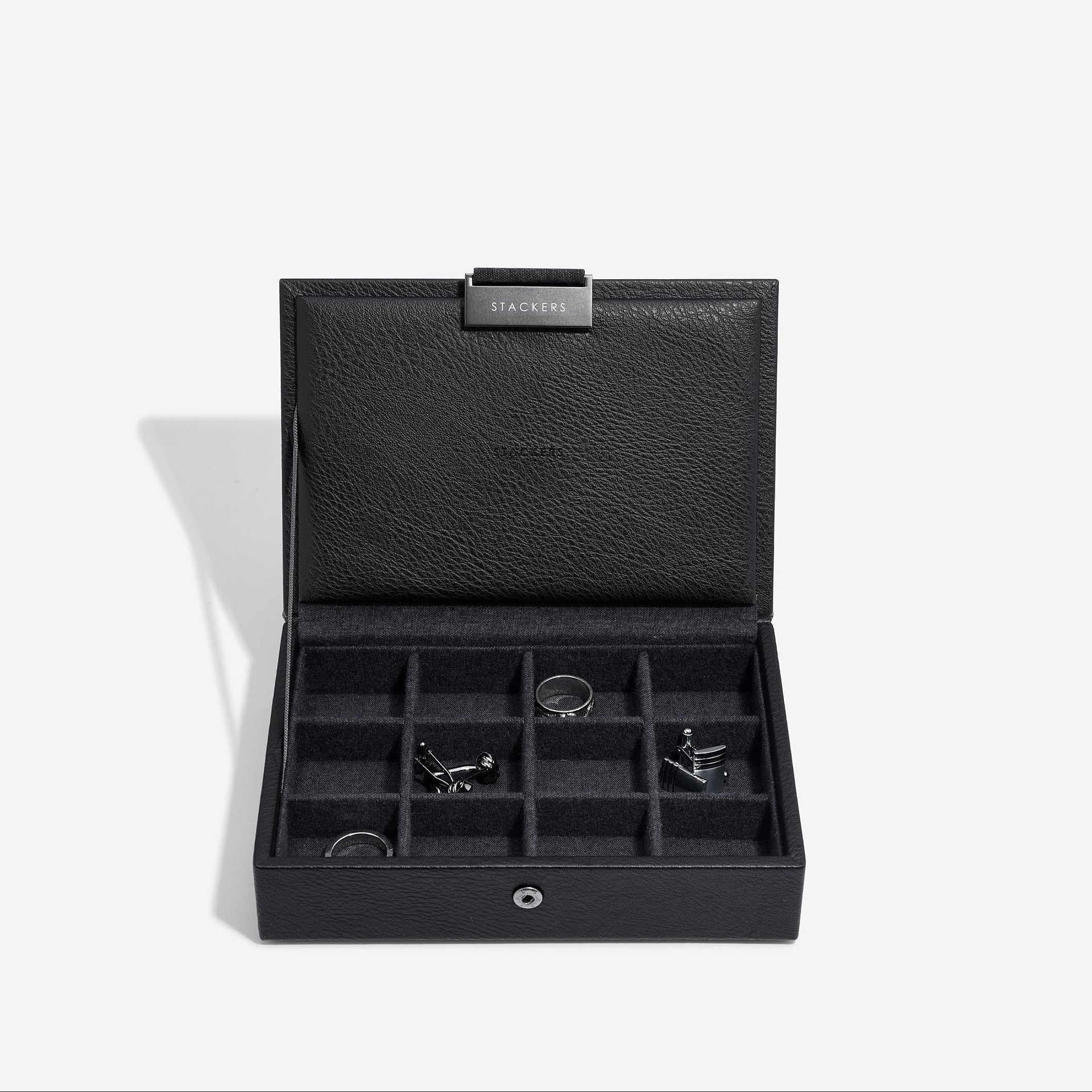 Black jewelry box with compartments on a white background